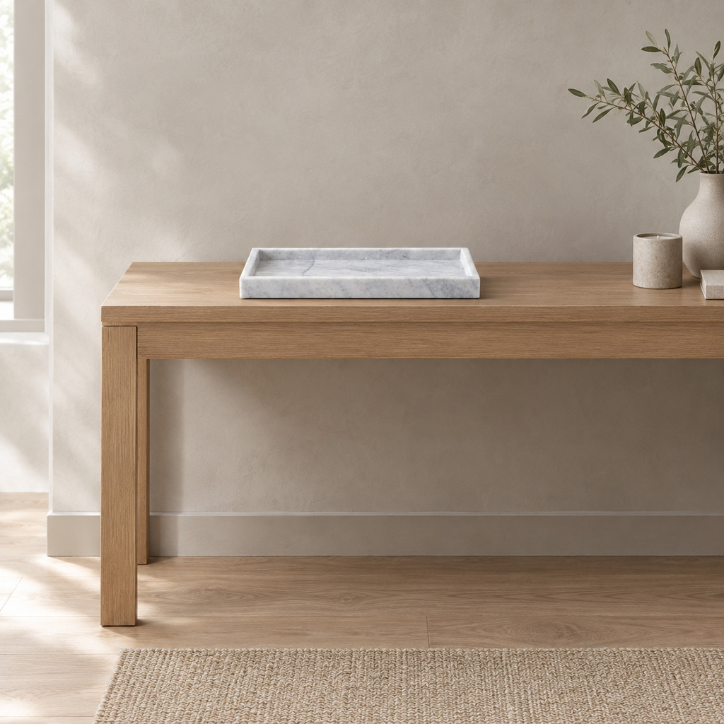 Cloud White rectangular marble vanity tray on an oak console table in a calm room.