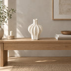 Coarse ceramic fluted vase in Speckled White on an oak console table in a calm room.