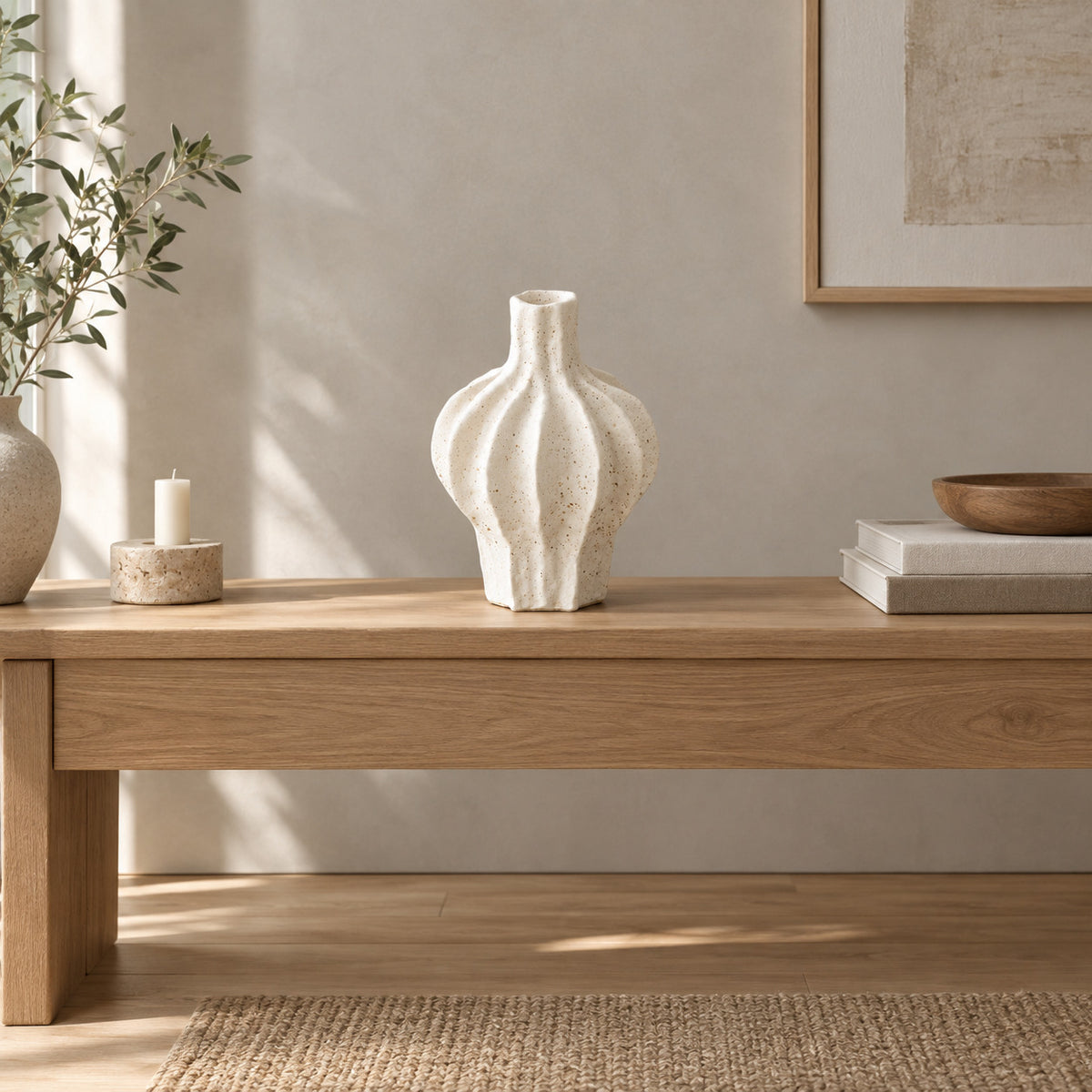 Coarse ceramic fluted vase in Speckled White on an oak console table in a calm room.