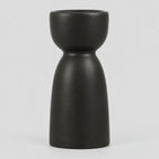 Matte ceramic taper candle holder in Matte Black on a light gray studio background.