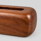 Close up of the rim or lip of the top dispensing slot on the curved solid wood tissue box cover in Walnut.