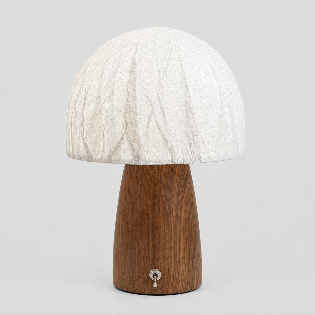Walnut mushroom table lamp with a textured dome shade on a light gray studio background