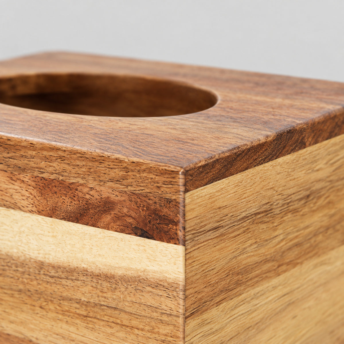 Close up of the beveled rim along the top of the square acacia wood tissue box cover