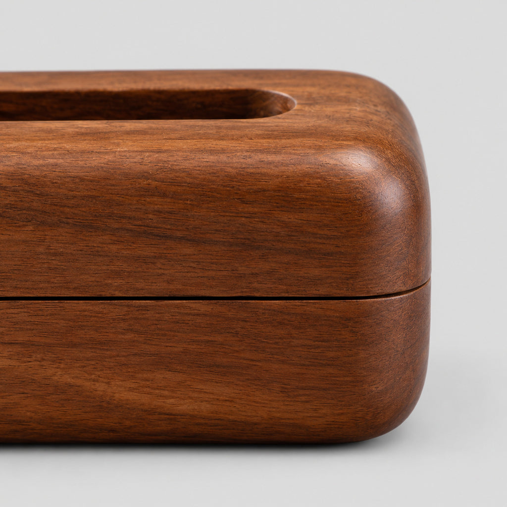 Close up of the horizontal seam between the lid and base of the rounded wooden tissue box cover in Walnut.