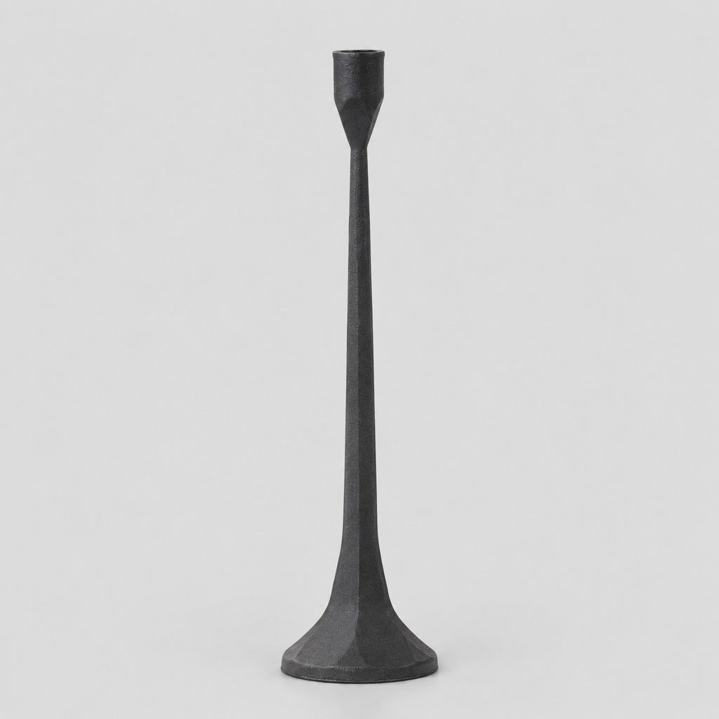 Cast iron taper candle holder in Matte Black on a light gray studio background.