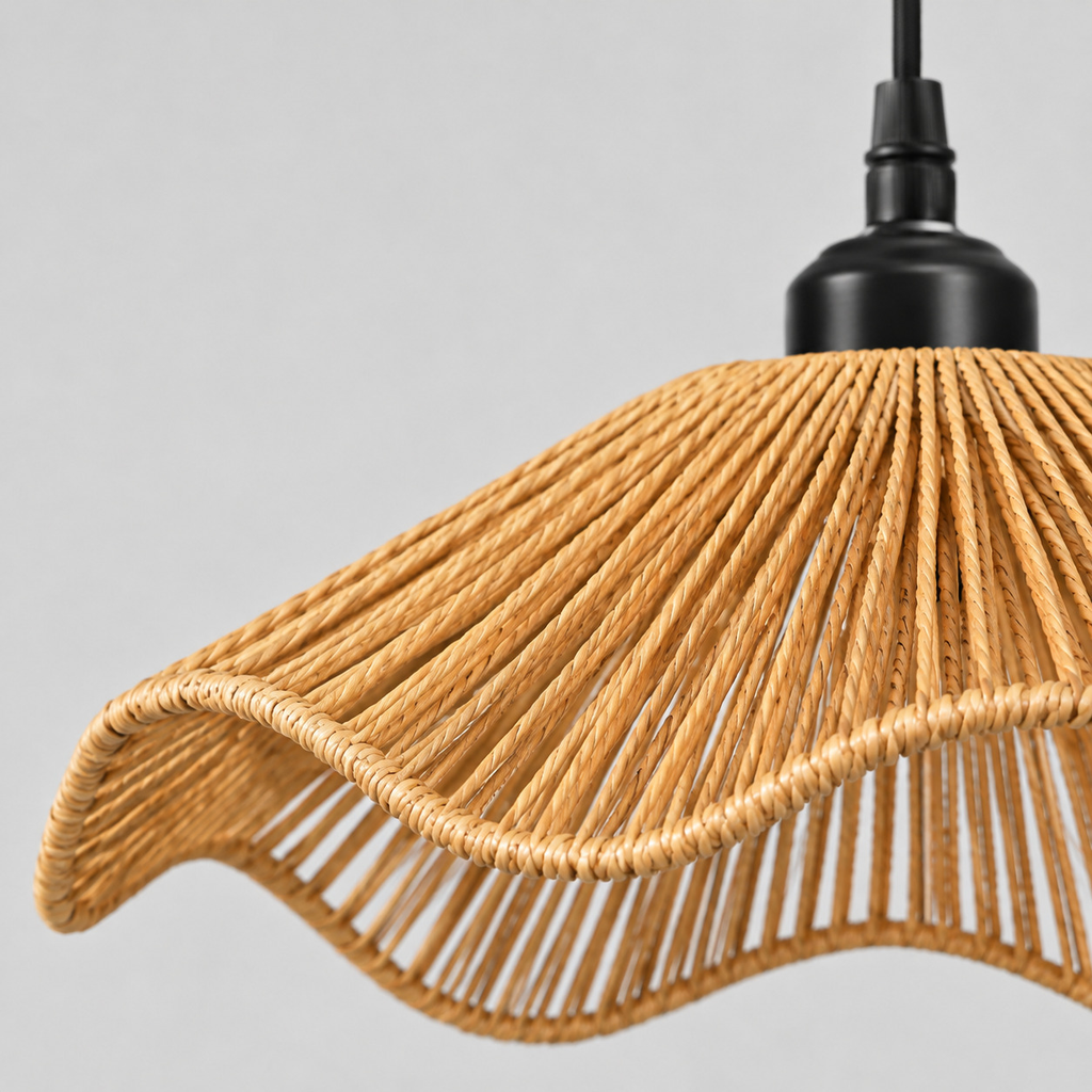Close up of the weave or fabric texture of the shade on the wavy rattan pendant light.