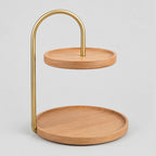 Two-tier round wooden serving tray in Beech on a light gray studio background.