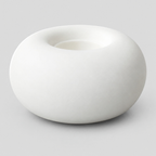 Matte White ceramic donut candle holder on a light gray studio background.