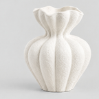 Fluted ruffled ceramic vase in Matte White on a light gray studio background.