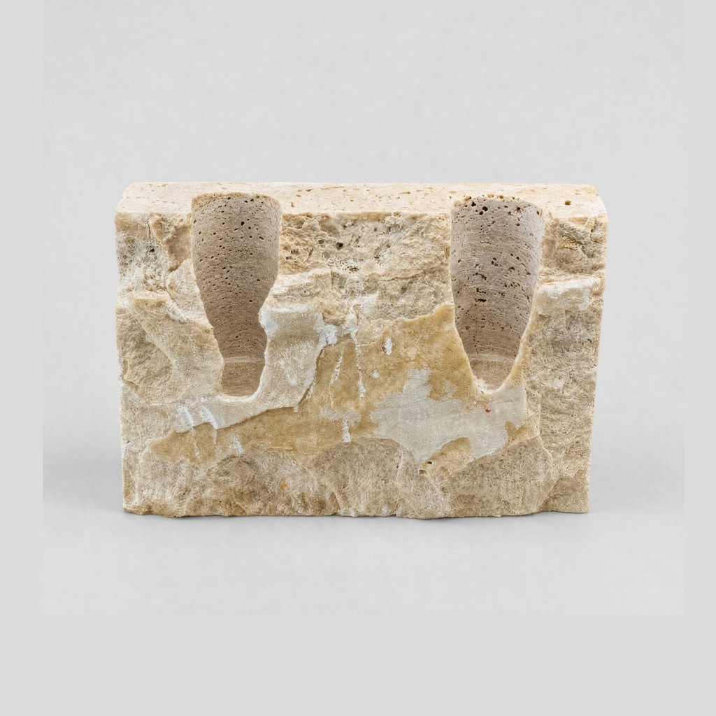 Chiseled travertine stone candle holder in the Travertine finish on a light gray studio background
