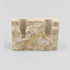 Chiseled travertine stone candle holder in the Travertine finish on a light gray studio background
