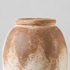 Close up of the rolled ceramic rim at the top of the textured ceramic vase.