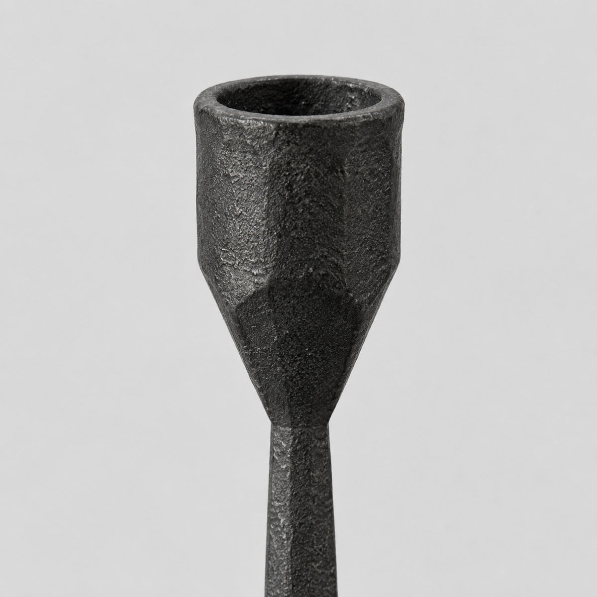 Close up of the candle cup rim of the cast iron taper candle holder in Matte Black.