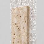 Close up of the textured ice-pattern acrylic diffuser panel of the yellow travertine block wall sconce in Yellow Travertine.