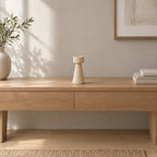 Travertine stone candle holder on an oak console table in a calm room