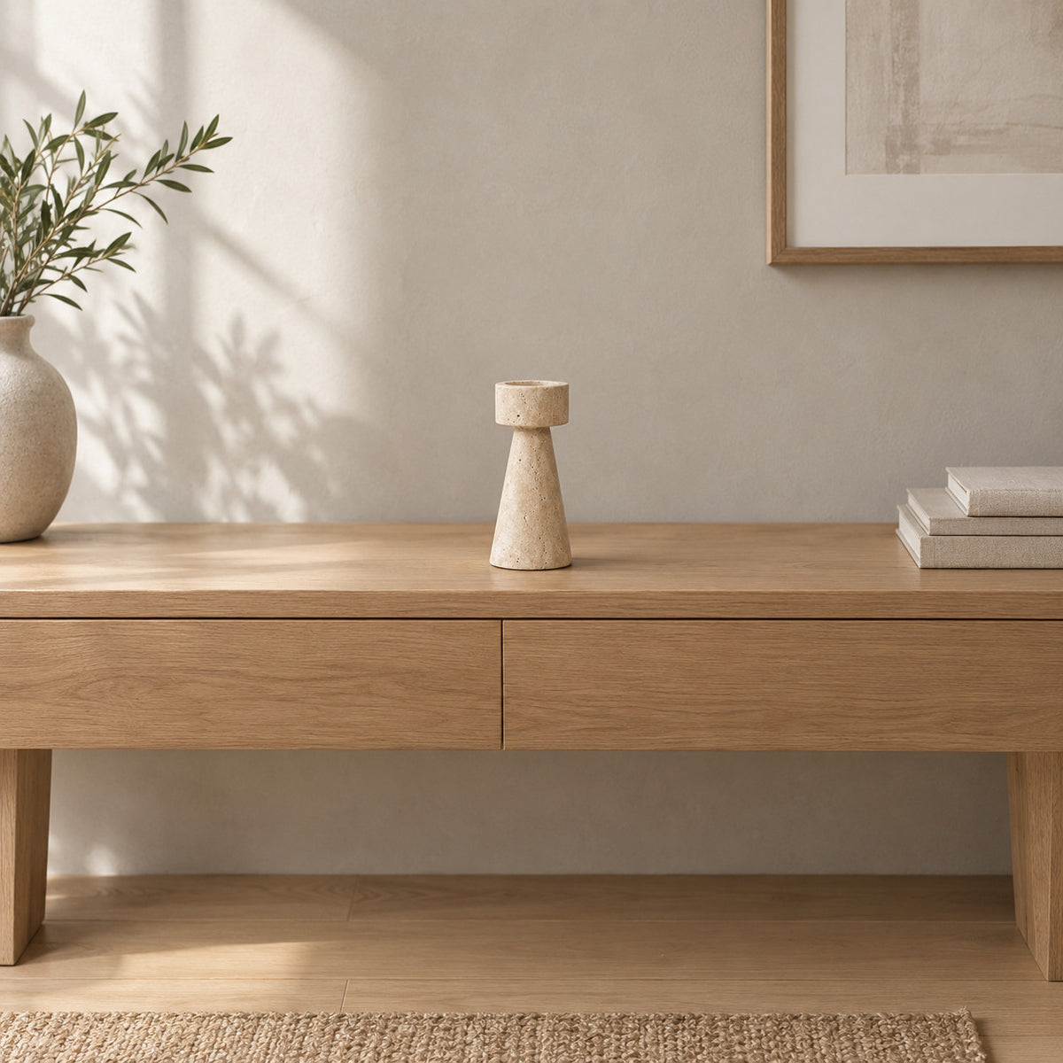 Travertine stone candle holder on an oak console table in a calm room