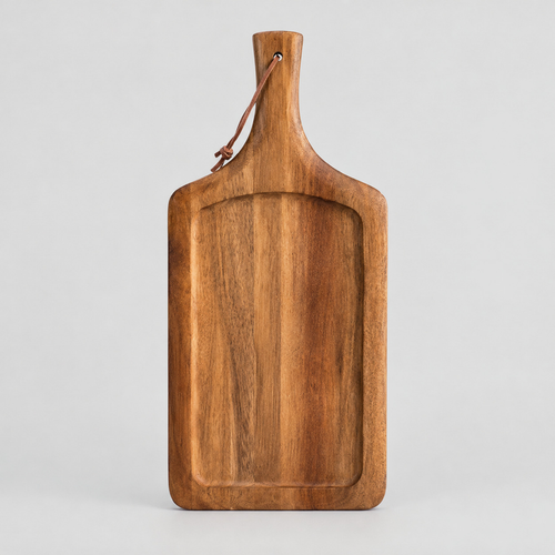 Acacia wood handled serving board in Natural Acacia on a light gray studio background.